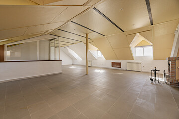 Large attic attic with a metal column in the center