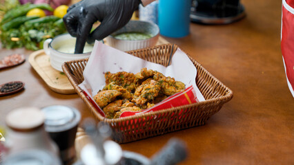 Potato Pakora, Palak Pakora with Green Chutney and Mint chutney on the table