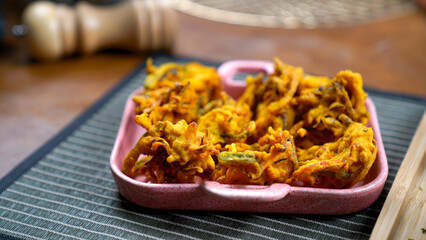 Potato Pakora, Palak Pakora with Tamarind Chutney and Potato Ketchup on the table