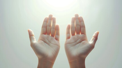 Simple yet powerful image of hands reaching for sunlight suggesting hope and spirituality