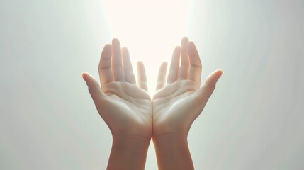 Simple yet powerful image of hands reaching for sunlight suggesting hope and spirituality