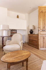 Living room of a country house with vintage wooden doors and matching decoration