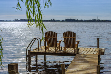 Rondeau Provincial Park lake Erie bay pier with muskoka chairs, Ontario, Canada - obrazy, fototapety, plakaty