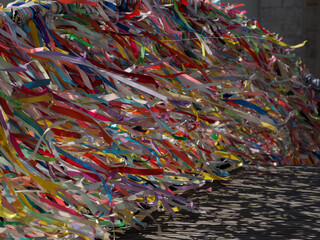 Love ribbons on the bridge over portuguese venice in Aveiro moved by the wind
