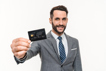 Happy businessman promoting credit card isolated over white background. Bank manager paying purchasing doing online shopping with debit card, e-baking concept