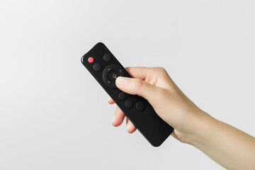 hand turns on the light with the remote control