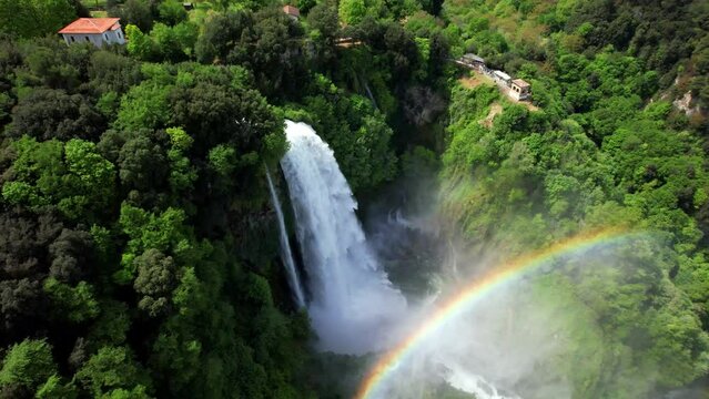 Aerial View of Cascata delle Marmore with Rainbow in Umbria Italy. Cinematic Drone Flight over Highest Man-Made Waterfall in the World. Powerful Water Cascades and Roman Heritage 4K.