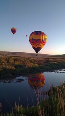 Fototapeta premium A hot air balloon launch showing 3 balloons under a clear sky