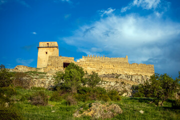 Obraz premium View of the crenellated walls on the rise of the medieval castle of Taibilla in Nerpio, Albacete, Castilla la Mancha, Spain in a rocky environment