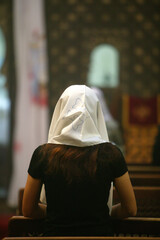 Coptic woman praying in a church.