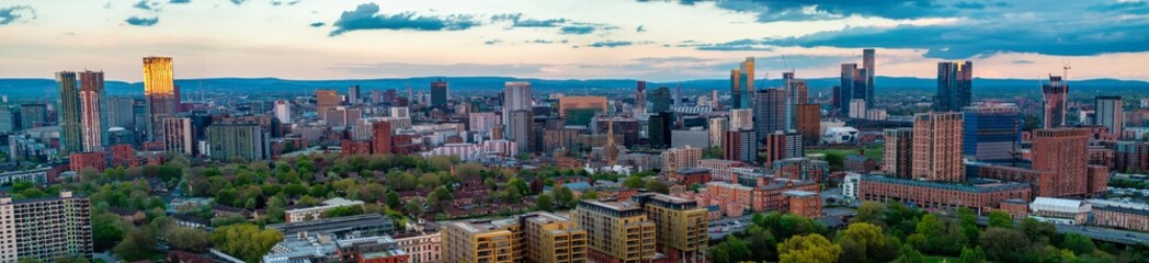 Aerial panorama of Manchester and Salford Skyline at sunset time