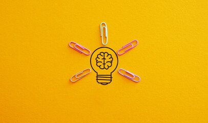 Creative thinking ideas brain innovation concept. Light bulb on yellow background as metaphor of...
