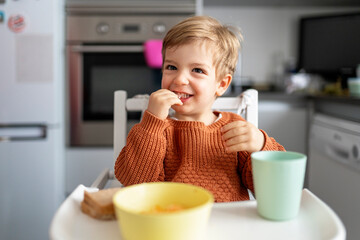 Portrait of a little boy eating