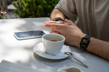 person drinking coffee in cafe