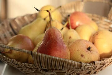 Juicy yellow pears in a wooden basket