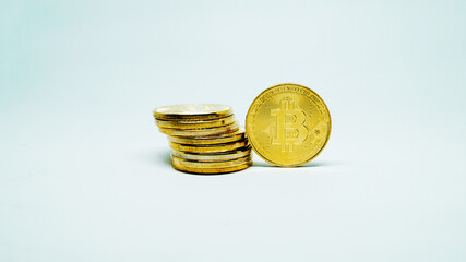 Cryptocurrency golden coins - Bitcoin on white background. Virtual money concept.