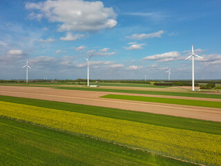 Spring farmland and electric windmills.