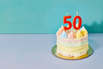 50th birthday cake celebrating 50 years on an isolated, colorful pastel background