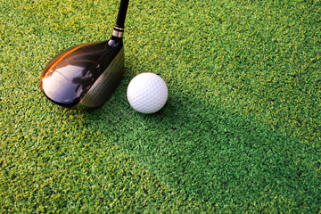 Golf ball placed on artificial grass.