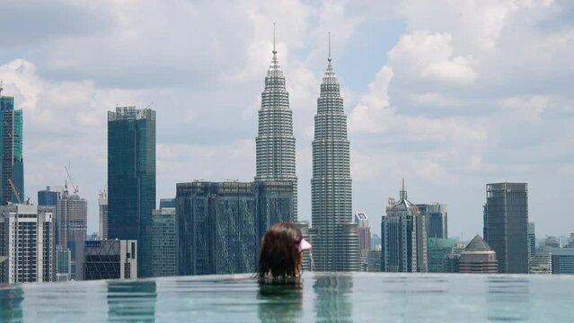 Infinity Pool In The Rooftop Of A Hotel With Petronas Twin Towers In The Background In Kuala Lumpur, Malaysia. Close-up Shot
