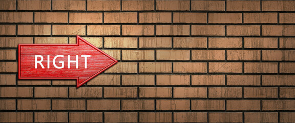 Red wooden arrow sign with the word RIGHT hanging on a dark brick wall. Right arrow pointer