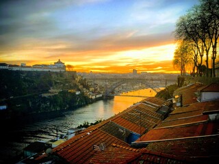 Luís I Bridge over Douro river against sky during sunset in Porto, Portugal, December 2018 - Powered by Adobe
