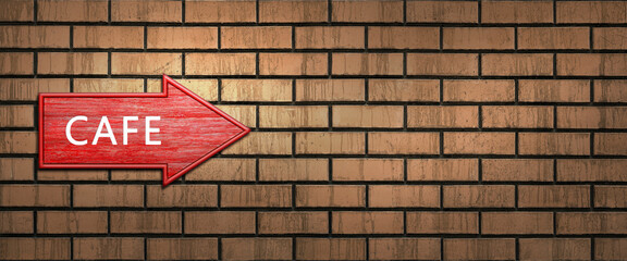 Red wooden shooter sign with the inscription CAFE hangs on a dark brick wall. Right arrow pointer