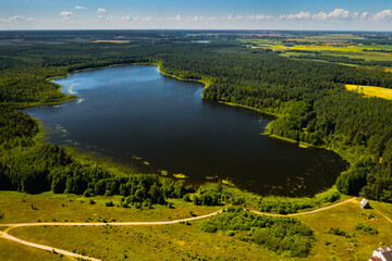 Top view of Bolta lake in the forest in the Braslav lakes National Park at dawn, the most beautiful...