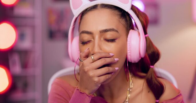 Headphones, influencer and woman live streaming, tired and technology for social media and online. Bedroom, creator and female person with internet, yawn and digital, viral and entertainment