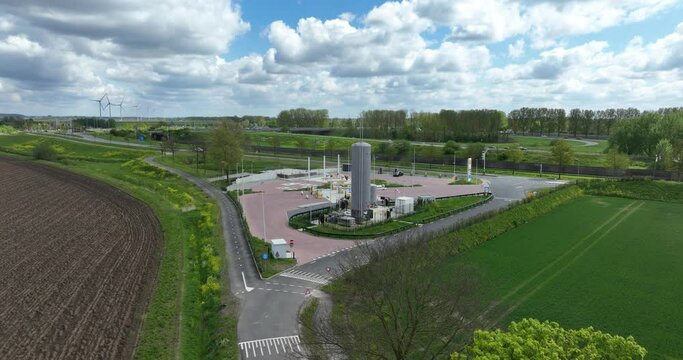 Truck diesel and LNG gas stations, hydrogen installations, and electric charging points for vehicles. Aerial drone view.