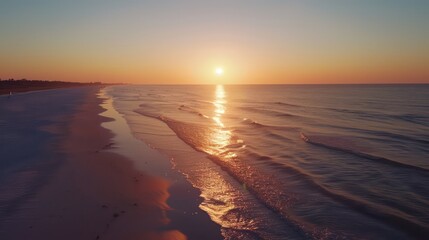 Obraz premium wide beach landscape view from sideways with a gorgeous sunset