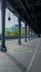 Elegant urban scene with a symmetric view of a bicycle lane under a vintage-style colonnade,...