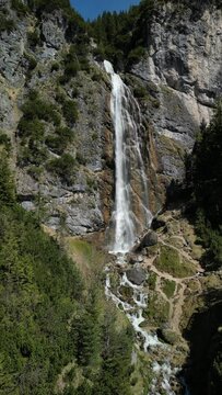 View to the dalfazer Waterfall with forest landscape and the Achensee as a close neighbor