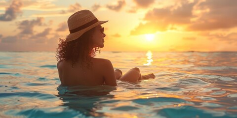 Woman enjoying vacation at beach during sunset