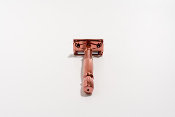 Metal razor on a white background. Razor close-up.