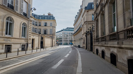 Deserted urban street in Paris with classical architecture, perfect for themes like city lockdown,...