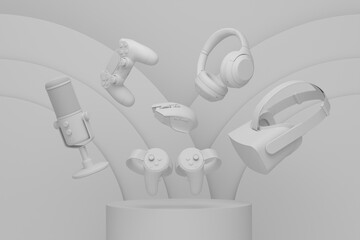 Set of video game joystick, microphone and headphones on monochrome podium
