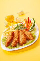 Fried Breaded fillets with fries and salad with dip