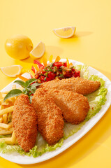 Fried Breaded fillets with fries and salad with dip