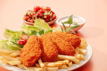 Spicy Tandoori Breaded Chicken Fried fillets with fires and salads