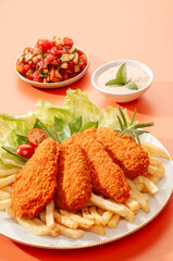 Spicy Tandoori Breaded Chicken Fried fillets with fires and salads