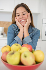 smiling woman about eating fresh apples