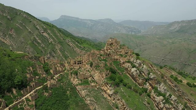 Old Gamsutl village on top of the mountain in Dagestan. Camera approaching ruined village