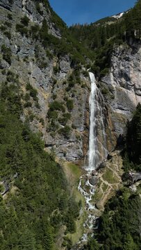 View to the dalfazer Waterfall with forest landscape and the Achensee as a close neighbor