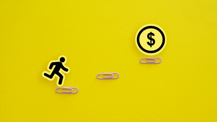 Financial goals are shown with A man climbing the stairs to a large coin