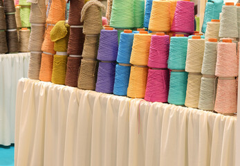 rolls of colored wool cotton thread during sale in a haberdashery counter