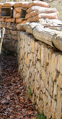 trench wartime with reinforcements of stones and stones and sandbags for protection