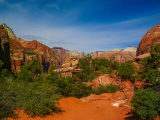 Panoramic aerial view from Zion National Park Canyon Overlook, Utah, USA. Tranquil atmosphere in wilderness. Uninhabited canyon with majestic rock formations and steep cliffs. Mountains, serene sky