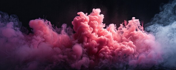 magenta and pink fluffy pastel ink smoke cloud against black background