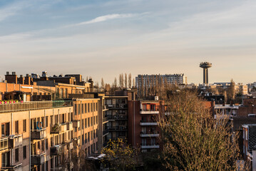 Schaerbeek, Brussels - Belgium - Panoramic view of the Brussels skyline at dusk with renovated apartment blocks and the Reyers broadcasting tower